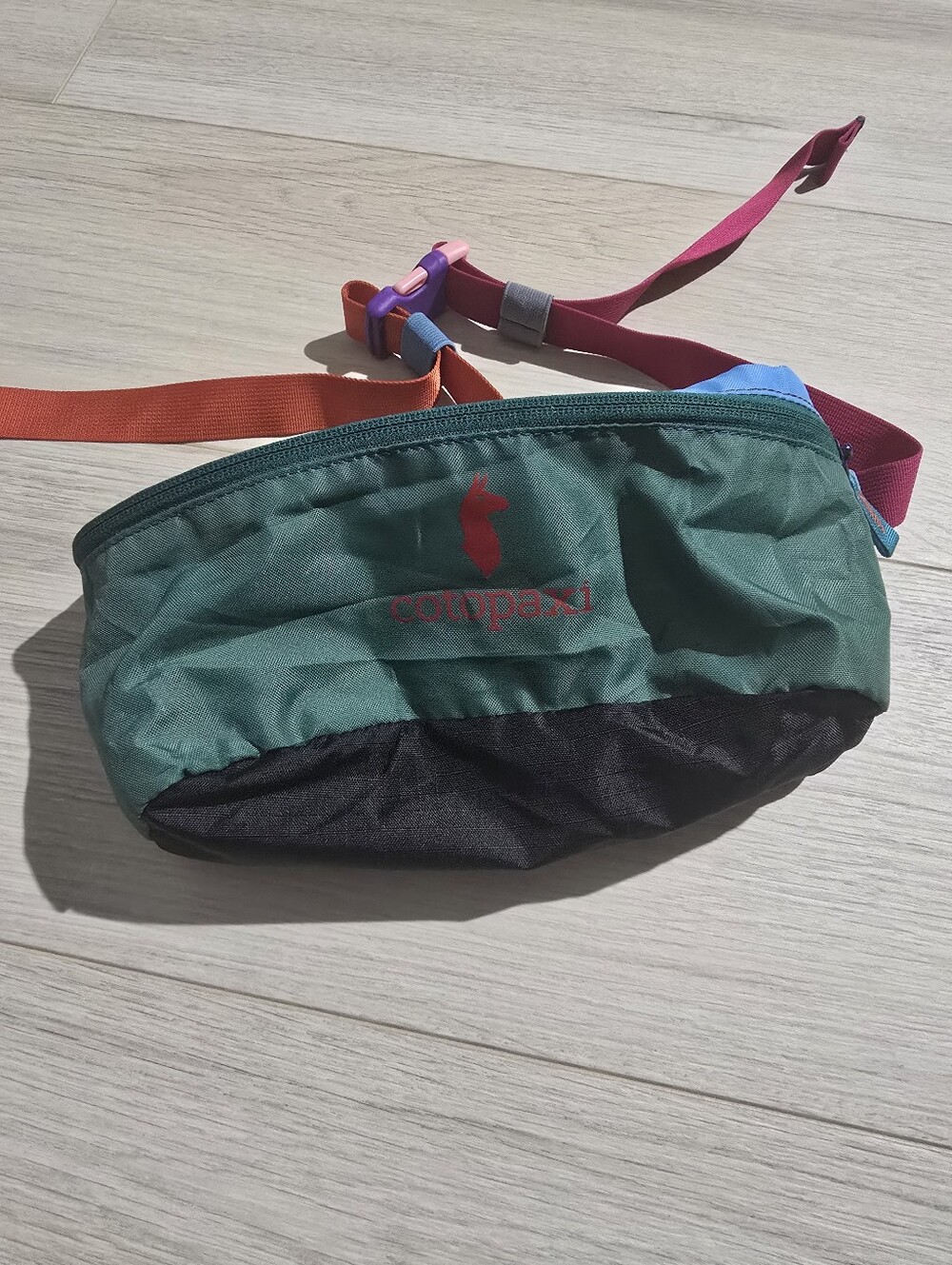 cotopaxi green black pink orange blue belt mini bag